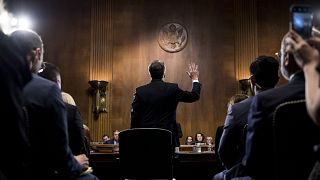 Image: Supreme Court nominee Judge Brett Kavanaugh is sworn in before testi