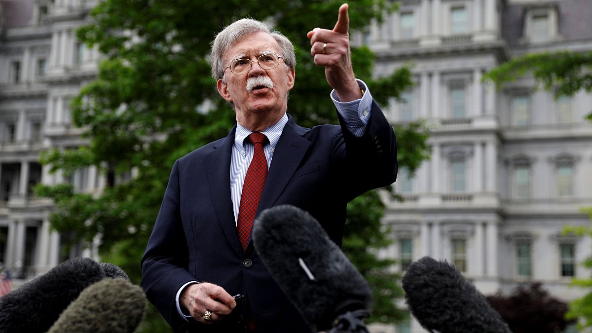 Image: National Security Adviser John Bolton speaks to reporters at the Whi