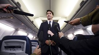 Image: Canadian Prime Minister Justin Trudeau speaks to reporters on his ca