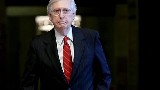 Image: Senate Majority Leader Mitch McConnell walks through the Capitol on 