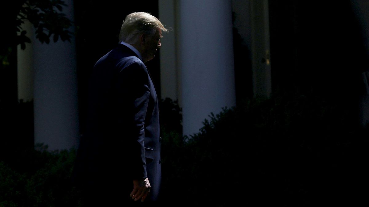 Image: President Donald Trump leaves the Rose Garden at the White House on 