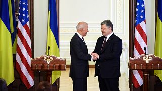 IMage: Vice President Joe Biden shakes hands with Ukranian President Petro