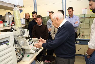 Raphael Mechoulam explaining the steps of the synthesis of stable CBD acid at his lab at Hebrew University in Israel. Mechoulam was the first to synthesize THC and discovered the endocannabinoid system, leading to the nickname "father of cannabis."