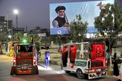 A poster of presidential candidate Abdullah Abdullah is displayed on a street on the outskirts of Kabul, Afghanistan. 