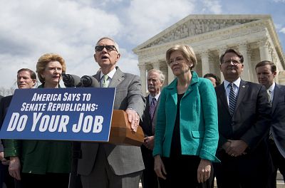 Harry Reid speaks alongside Elizabeth Warren and other Senate Democrats, outside the Supreme Court on March 17, 2016.
