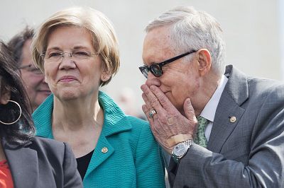 Harry Reid and Elizabeth Warren attend a news conference at the Supreme Court on March 17, 2016.