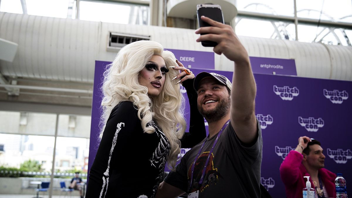 Image: Deere, the founder of Stream Queens, takes a selfie with a fan at Tw