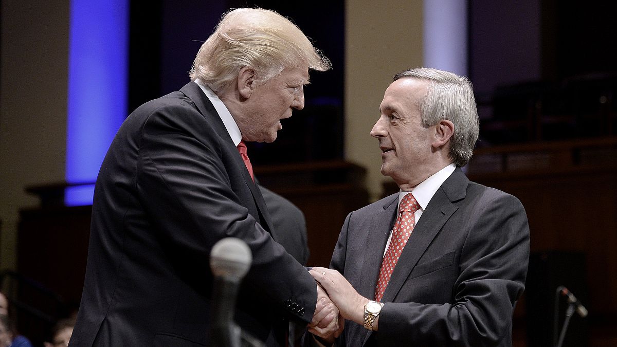 Image: President Donald Trump is greeted by Pastor Robert Jeffress during t