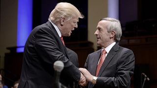 Image: President Donald Trump is greeted by Pastor Robert Jeffress during t