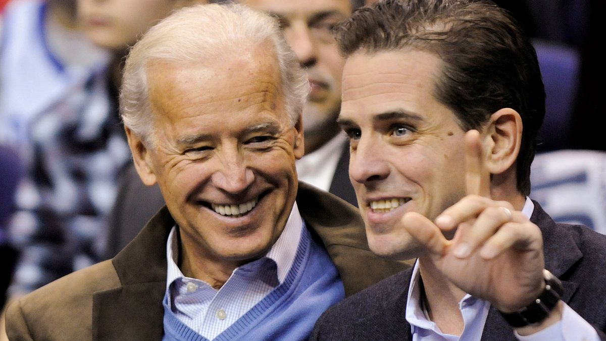 Image: Vice President Joe Biden and his son Hunter Biden attend an NCAA bas