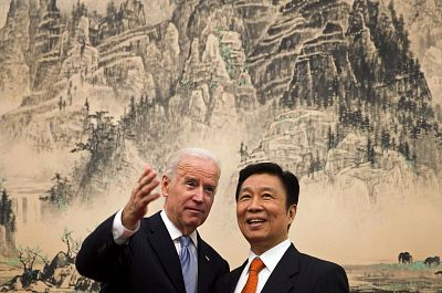 Vice President Joe Biden speaks with Chinese Vice Premier Li Yuanchao before a lunch in Beijing on Dec. 5, 2013.