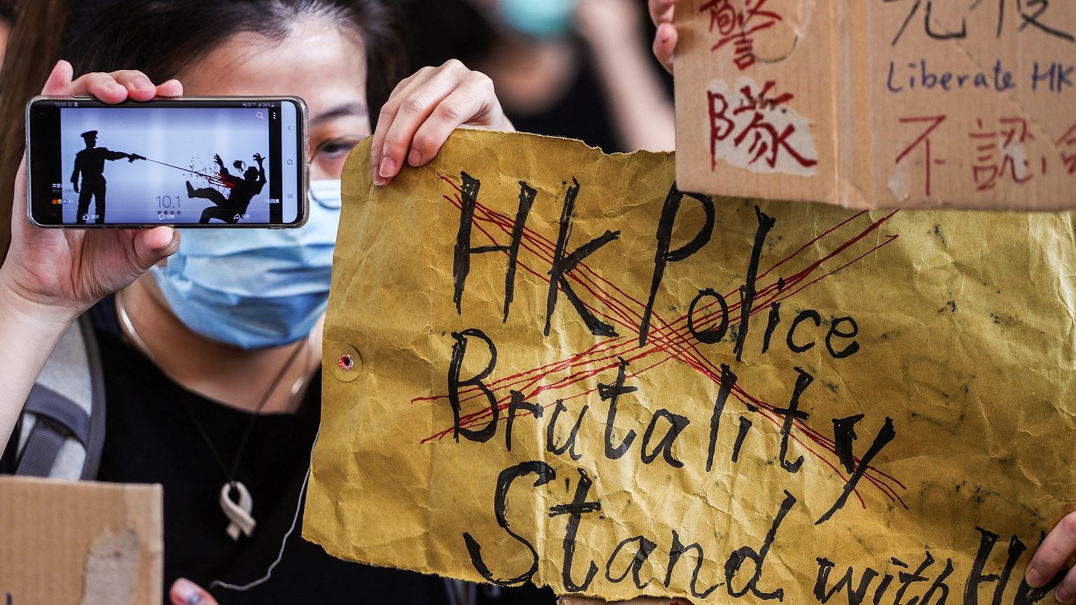 Image: People gather at West Kowloon Law Courts Building as they show their