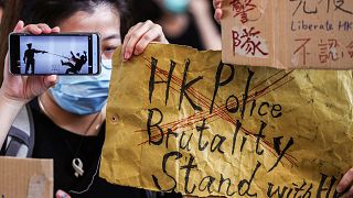 Image: People gather at West Kowloon Law Courts Building as they show their