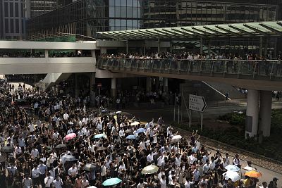 Anti-government protesters march at Central district in Hong Kong, Wednesday. 