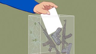 Illustration of hand casting ballot in ballot box full of guns.