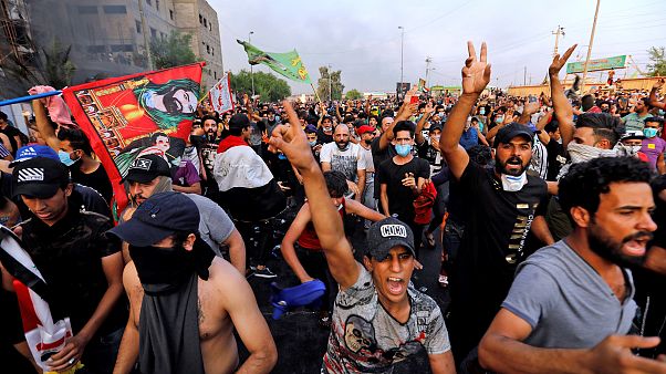 Image: Demonstrators gesture at a protest over unemployment, corruption and Image: Demonstrators gesture at a protest over unemployment, corruption and