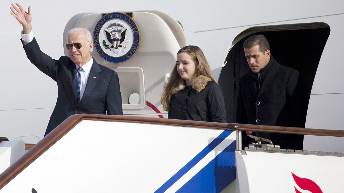 U.S. Vice President Biden waves as he walks out of Air Force Two with his g