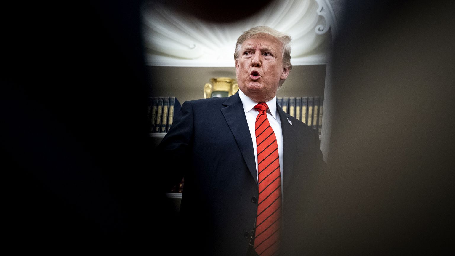 Image: President Donald Trump speaks to reporters in the Oval Office on Sep