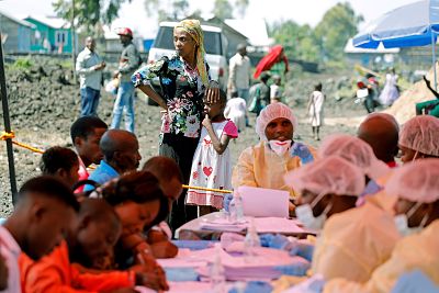 A woman and child wait to receive the Ebola vaccination in Goma, Democratic Republic of Congo, Aug. 5, 2019.
