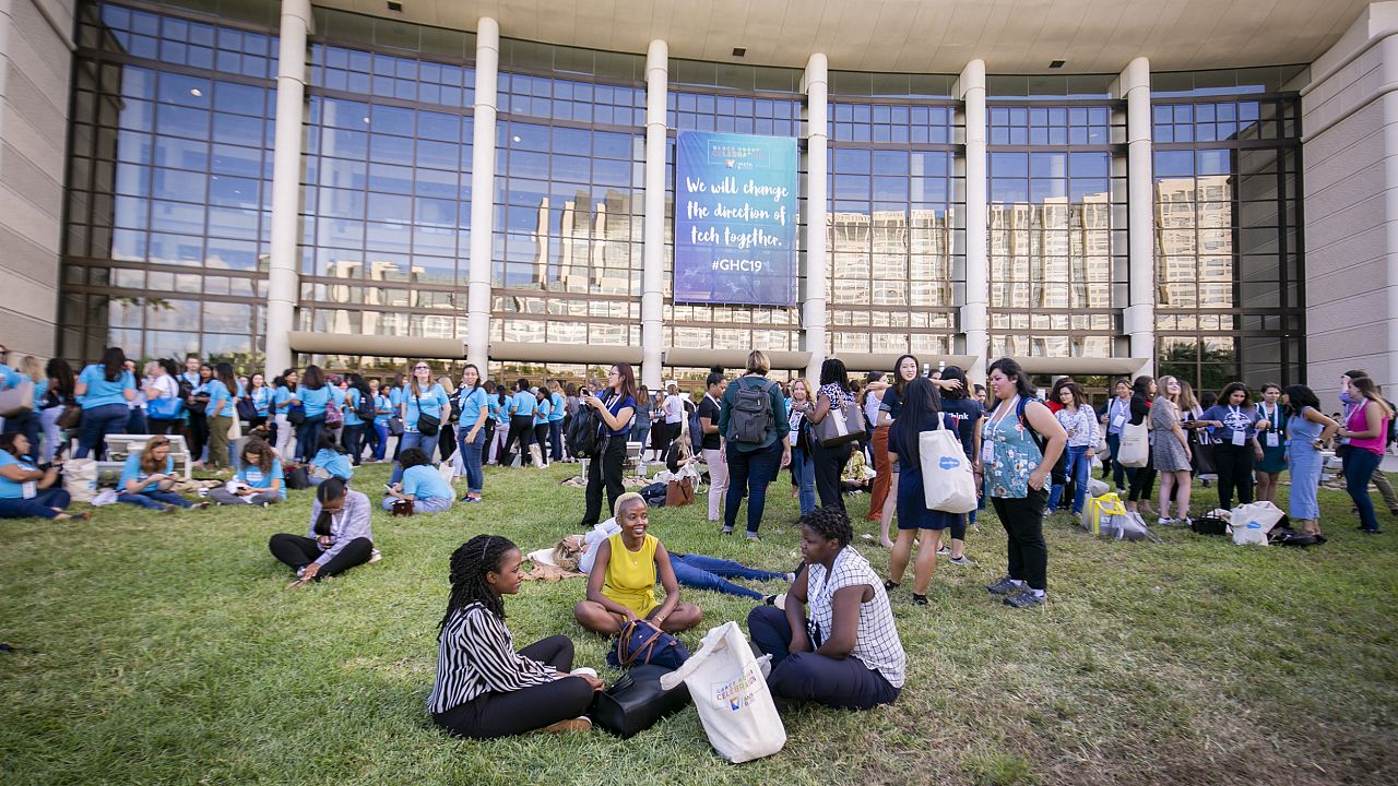 Attendees enjoy a break outside the convention center where the Grace Hoppe