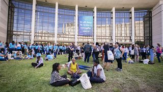 Attendees enjoy a break outside the convention center where the Grace Hoppe
