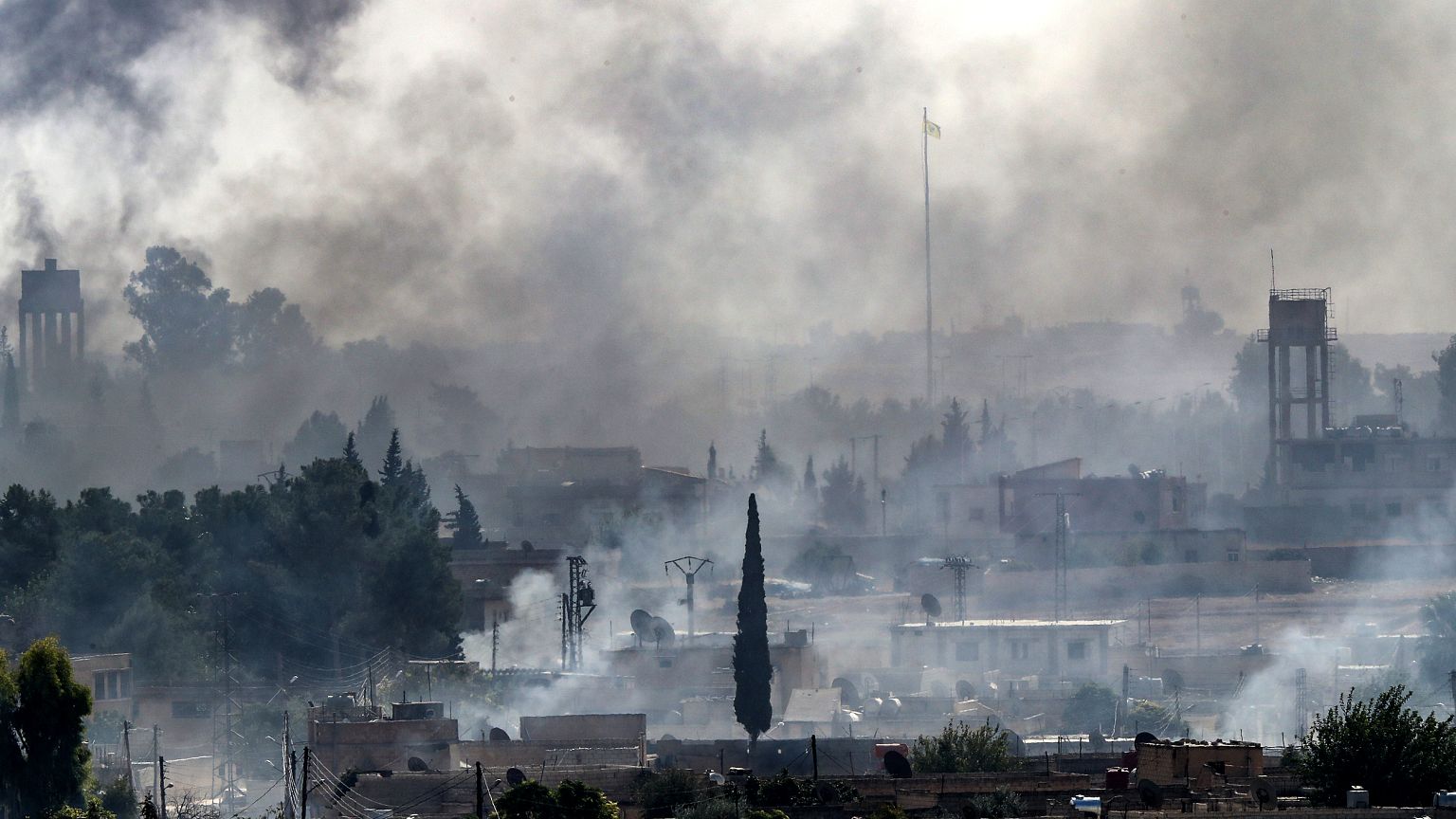 Image: Smoke rises over the Syrian town of Tel Abyad as Turkey continues a 