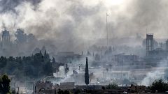 Image: Smoke rises over the Syrian town of Tel Abyad as Turkey continues a 