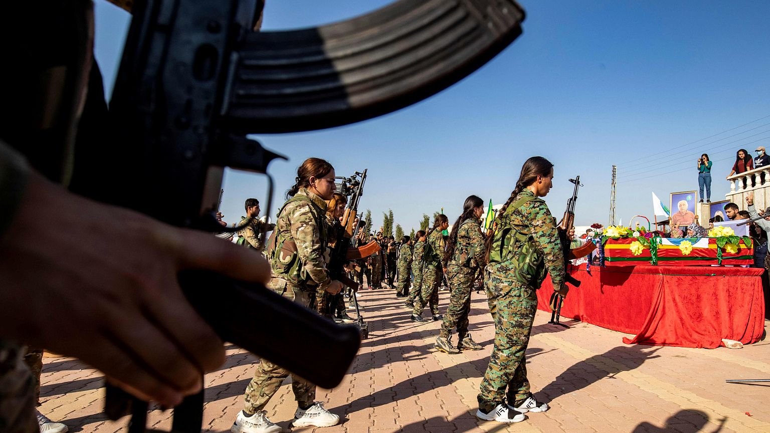 Image: Mourners attend a funeral for a Kurdish political leader, civilians 