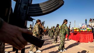 Image: Mourners attend a funeral for a Kurdish political leader, civilians 