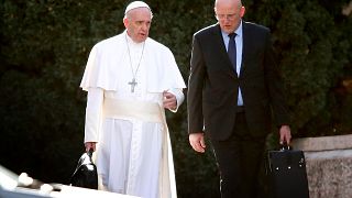 Image: Pope Francis walks with head of security Domenico Giani near Rome on