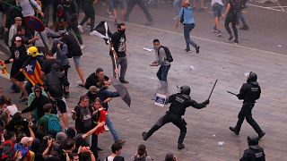 Image: Protesters clash with Spanish policemen outside El Prat airport in B