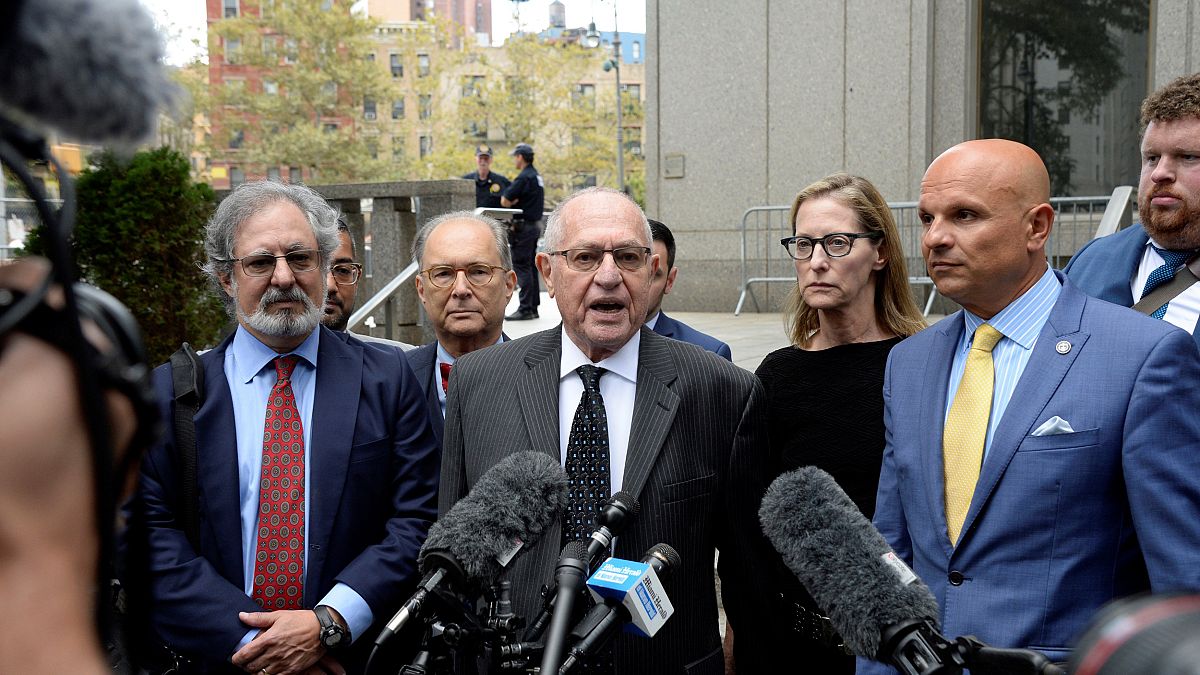 Image: Alan Dershowitz and his legal team, including Howard Cooper, wife Ca
