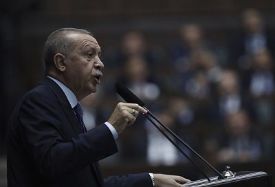 Turkish President Recep Tayyip Erdogan addresses his ruling party legislators at the Parliament, in Ankara, on Wednesday.