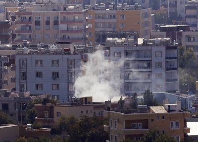 Smoke billows from targets in Ras al-Ayn, Syria, caused were attacks continued Friday.