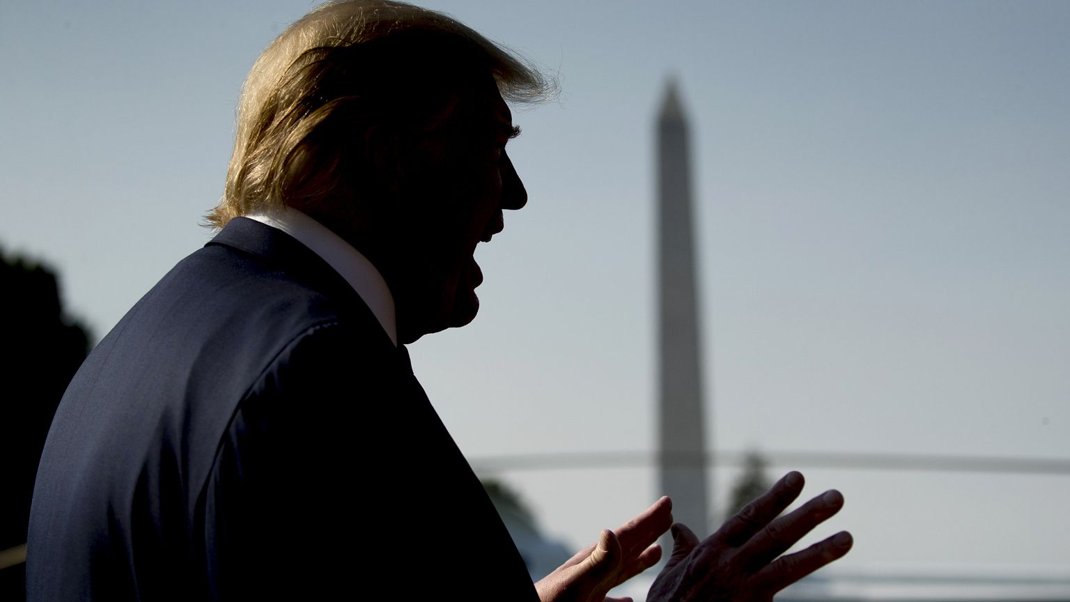 Image: President Donald Trump speaks to the media before departing the Whit