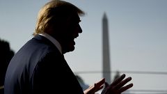 Image: President Donald Trump speaks to the media before departing the Whit