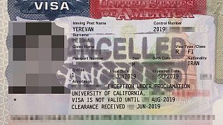 A "cancelled" stamp can  be seen on a U.S. visa provided by an Iranian stud