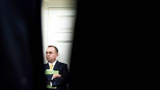 Image: Acting White House Chief of Staff Mick Mulvaney listens in the Oval