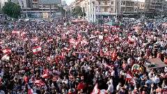 Image: Demonstrators carry national flags during an anti-government protest