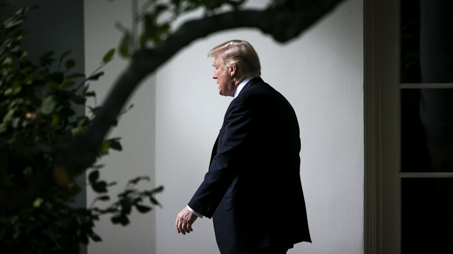 Image: President Donald Trump exits the Oval Office on Oct. 25, 2017.