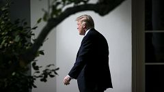 Image: President Donald Trump exits the Oval Office on Oct. 25, 2017.