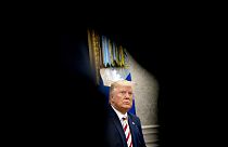 Image: President Donald Trump listens to a question in the Oval Office on A