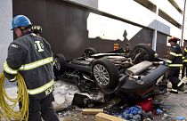 Image: Two people are dead after a car drove off a 4th floor parking garage