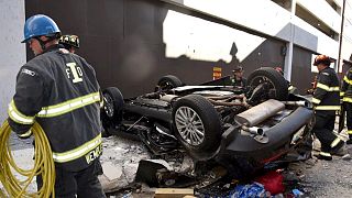 Image: Two people are dead after a car drove off a 4th floor parking garage