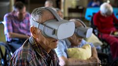 Image: Jim Halsey watches nature scenes through a virtual reality device at