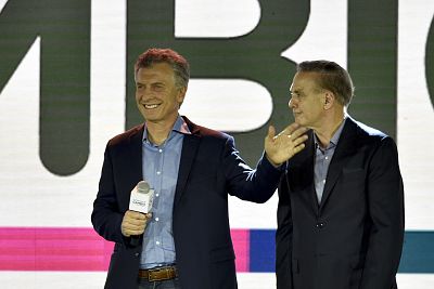 President Mauricio Macri, who was running for re-election, concedes defeat next to his running mate, Miguel Angel Pichetto, in Buenos Aires, Argentina, on Sunday.