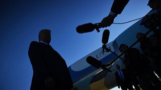 Image: President Donald Trump speaks to the press before boarding Air Force