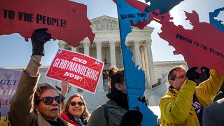 Image: Demonstrators protest against gerrymandering at the Supreme Court on