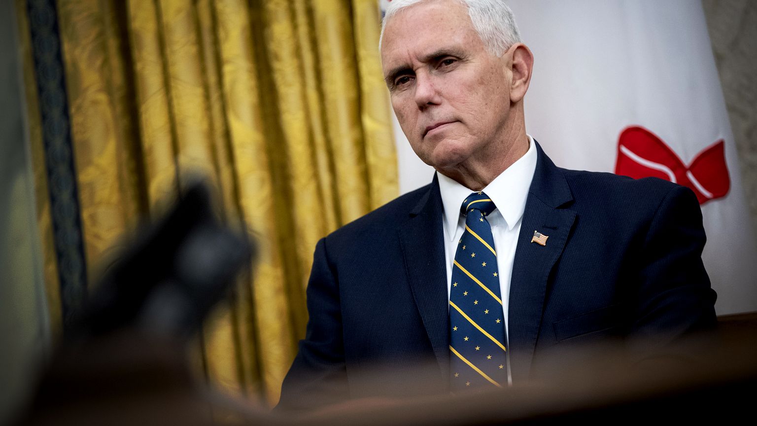 Image: Vice President Mike Pence listens during a meeting in the Oval Offic