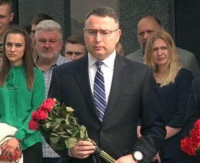 National Security Council Director for European Affairs Alexander Vindman prepares to lay flowers in honor of fallen Ukrainian soldiers in a photo posted on the U.S. Embassy Kiev Twitter account on May 31, 2019.